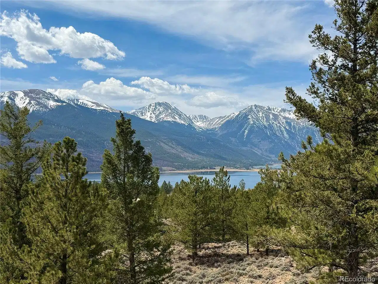 Image 1: Sloping lot with lake and mountain views! Image 1: Sloping lot with lake and mountain views!