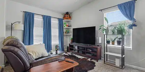 Image 4: The spacious Living Room is filled with natural lighting streaming in through the large windows found throughout the home! Image 4: The spacious Living Room is filled with natural lighting streaming in through the large windows found throughout the home!