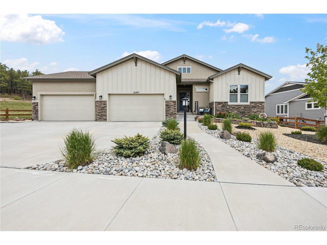 Image 1: Contemporary ranch-style residence featuring a stucco and board-and-batten facade with stacked stone accents Image 1: Contemporary ranch-style residence featuring a stucco and board-and-batten facade with stacked stone accents