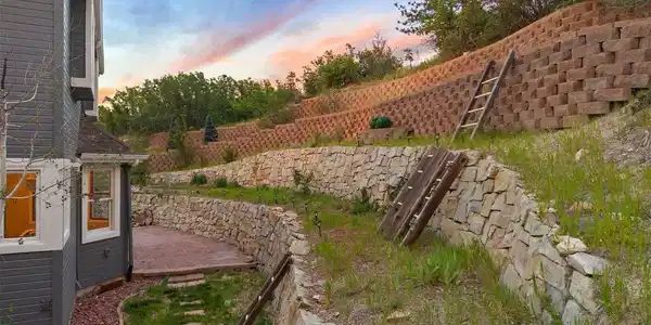 Image 3: Get creative with the stacked stone terraced landscaping - Imagine architectural garden beds or a clever playground for little adventurers. Image 3: Get creative with the stacked stone terraced landscaping - Imagine architectural garden beds or a clever playground for little adventurers.