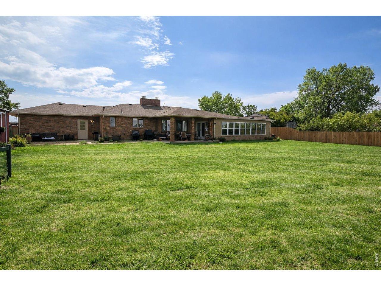 Image 2: Huge back yard ready for all your toys (Grass has been digitally enhanced for marketing purposes).