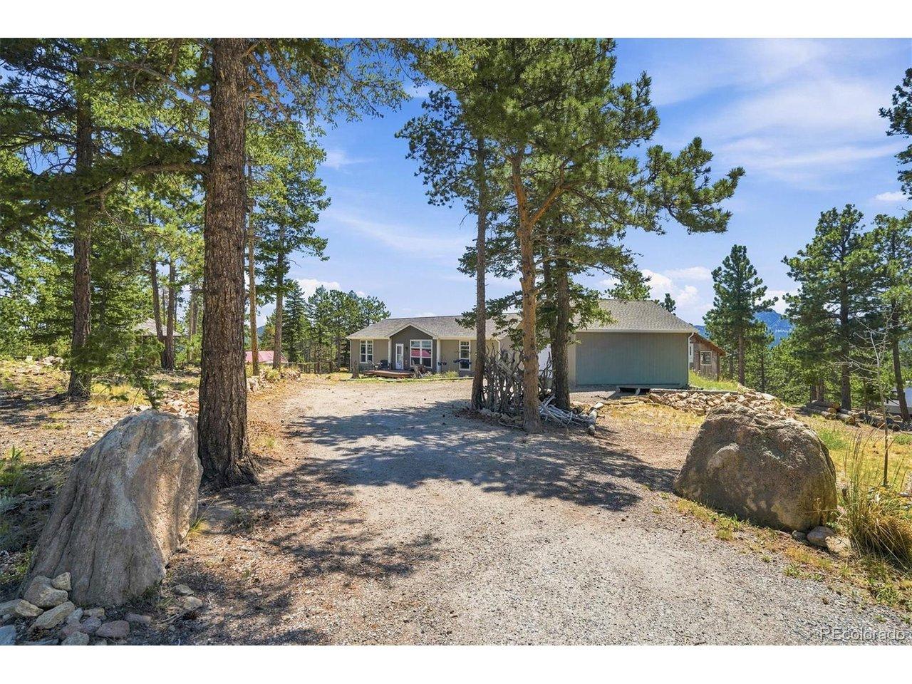 Image 2: Mature trees frame the driveway entrance Image 2: Mature trees frame the driveway entrance