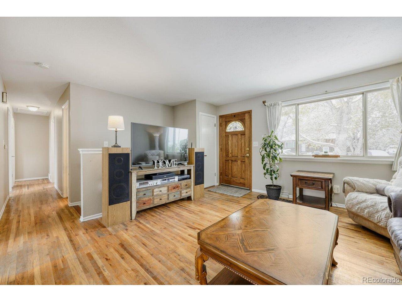 Image 4: Living Room with Hardwood Floors