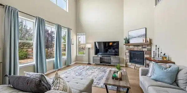 Image 3: Soaring ceilings and abundant windows create a dramatic, light-filled heart of the home. Image 3: Soaring ceilings and abundant windows create a dramatic, light-filled heart of the home.