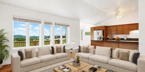 Image 2: Spacious, open-concept living room and kitchen featuring beautiful solid wood floors throughout and abundant natural light. Photo is virtually staged. Image 2: Spacious, open-concept living room and kitchen featuring beautiful solid wood floors throughout and abundant natural light. Photo is virtually staged.