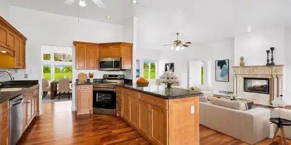 Image 4: Beautifully appointed kitchen featuring new stainless steel appliances, custom solid wood cabinetry, and gorgeous granite countertops. Photo is virtually staged. Image 4: Beautifully appointed kitchen featuring new stainless steel appliances, custom solid wood cabinetry, and gorgeous granite countertops. Photo is virtually staged.
