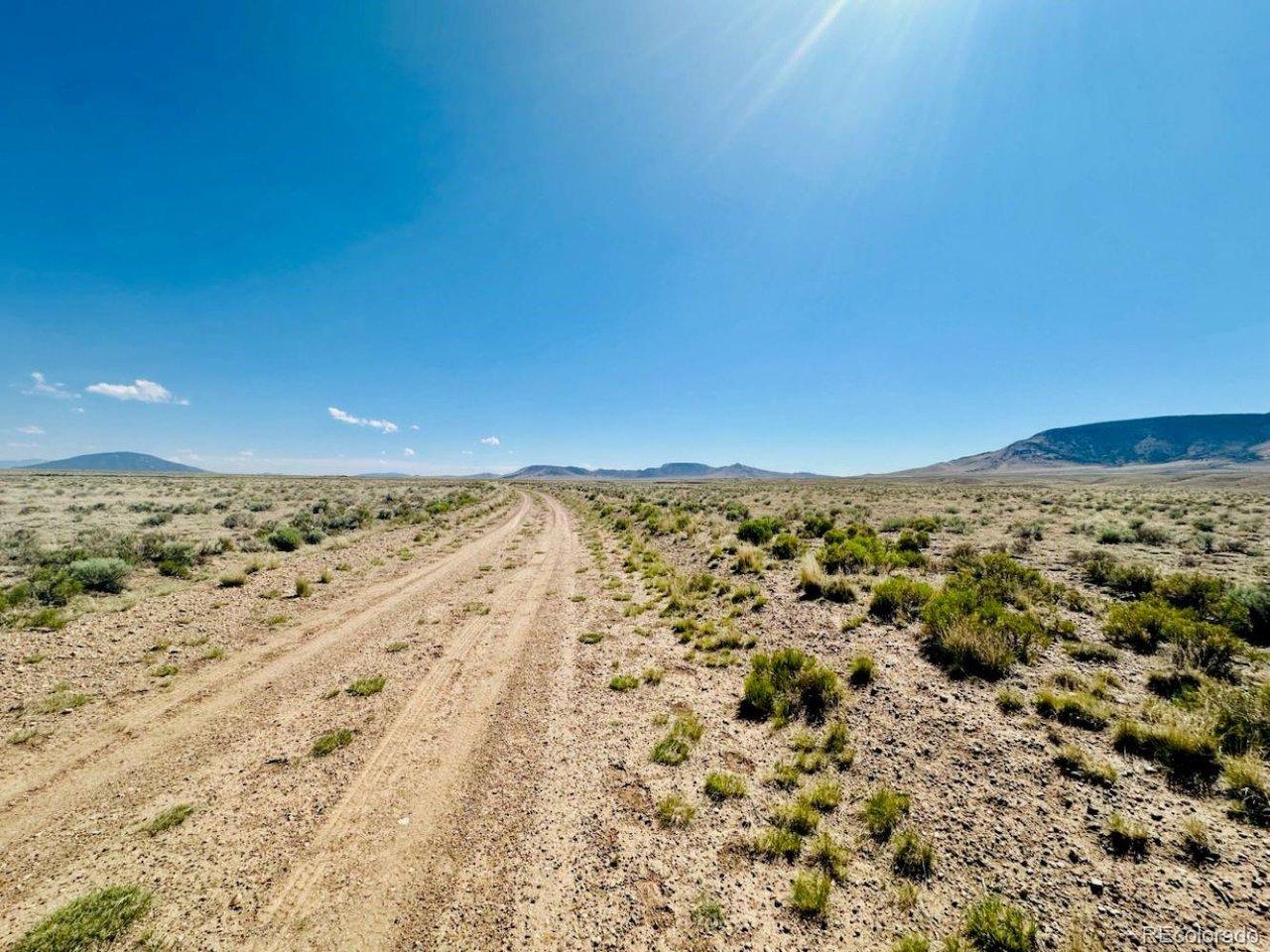 Image 4: Leo Road - view looking south. The subject property runs along the right side of this picture. Image 4: Leo Road - view looking south. The subject property runs along the right side of this picture.