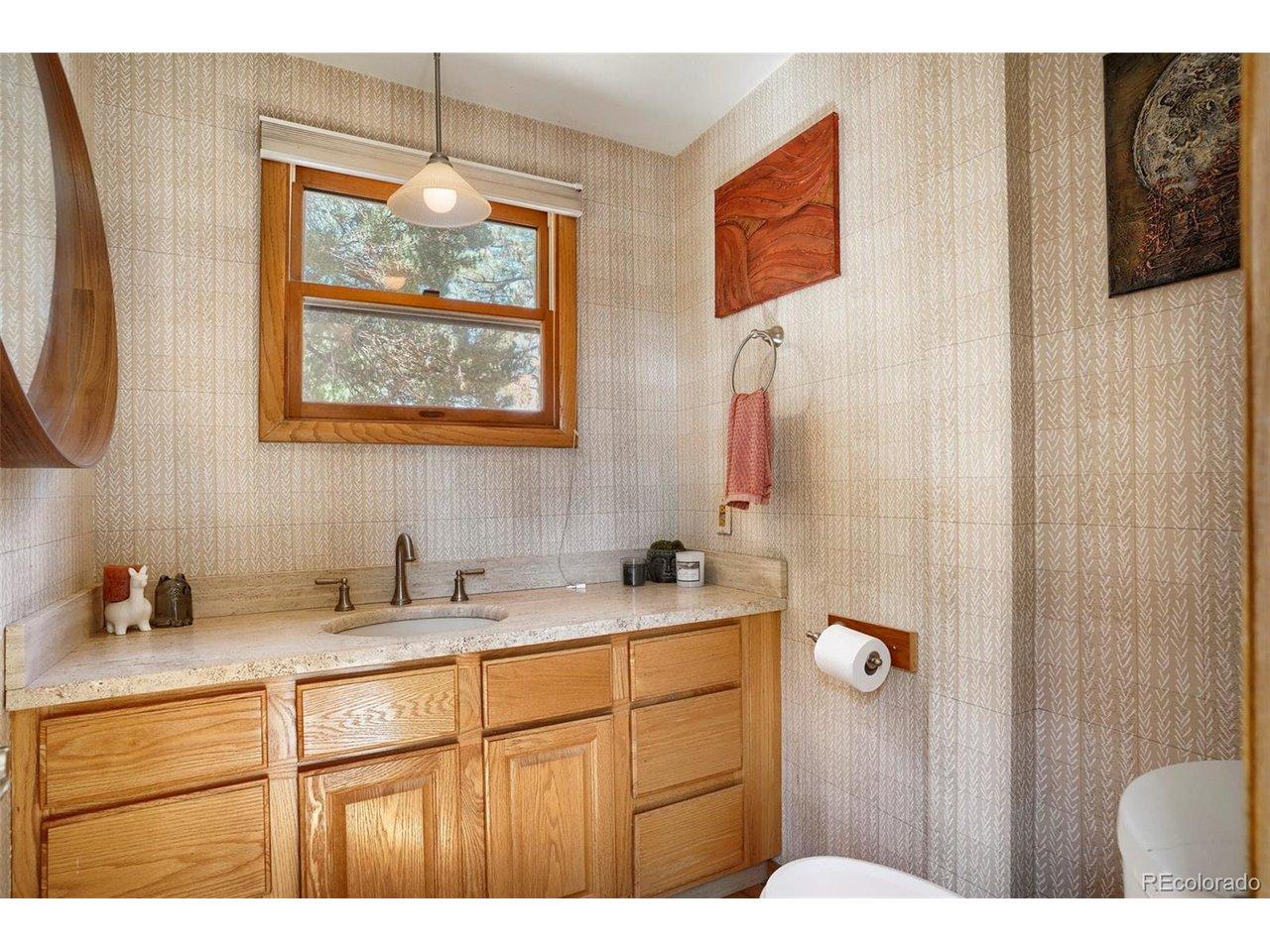 Image 3: Stunning powder room with high-end finishes and bright, natural lighting. Image 3: Stunning powder room with high-end finishes and bright, natural lighting.
