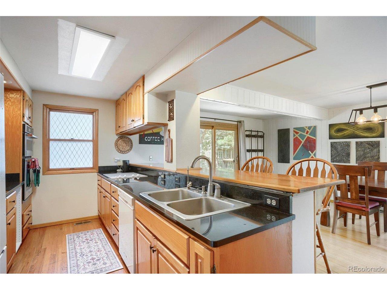 Image 4: This spacious, modern kitchen is filled with natural light and features an expansive layout, complete with extensive counter space Image 4: This spacious, modern kitchen is filled with natural light and features an expansive layout, complete with extensive counter space