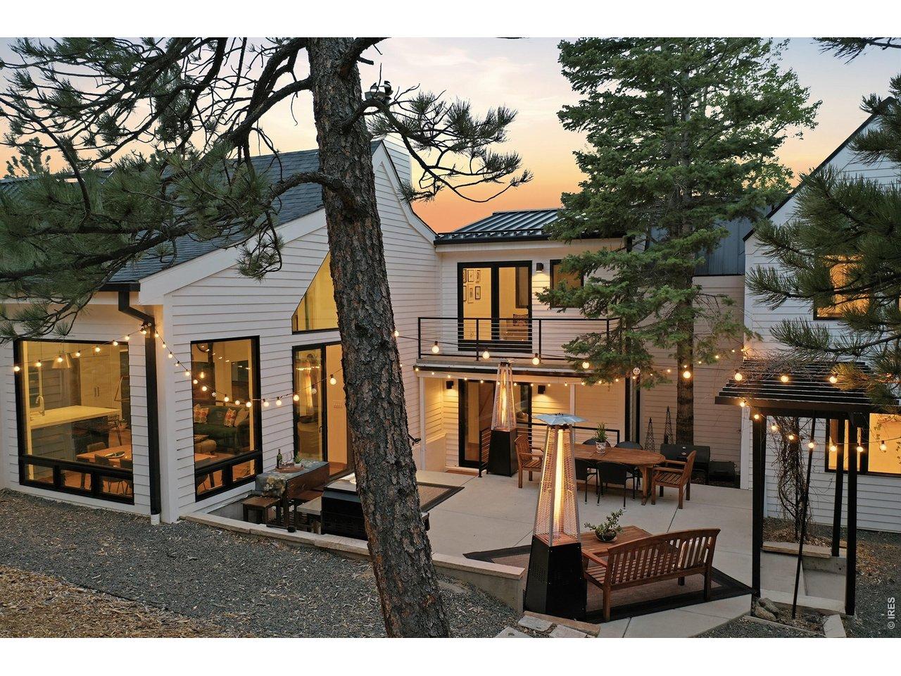 Image 3: Seamless indoor- outdoor living throughout with expansive upper and lower IPE wood decking and private patios with panoramic mountain views.
