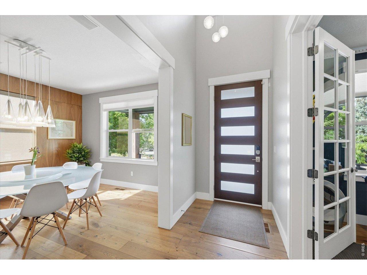 Image 4: Dramatic 2 story foyer with custom lighting and doors throughout Image 4: Dramatic 2 story foyer with custom lighting and doors throughout