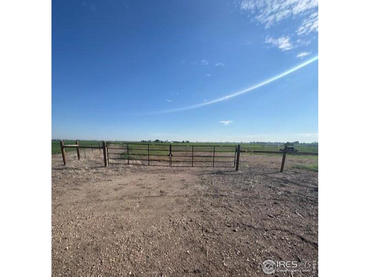 Image 2: Plenty of room off county road to access gate.