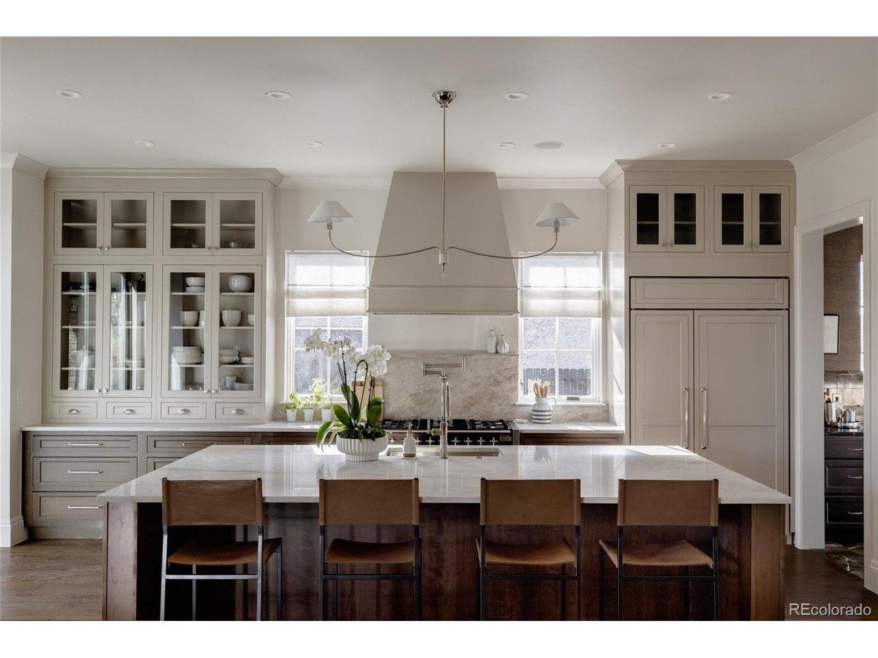 Image 4: Chef's kitchen equipped with AGA 48" oven, 2 bar fridges, 2 microwaves, and 2 dishwashers