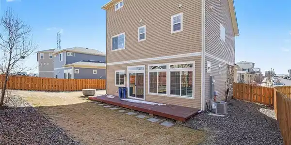 Image 3: Fully Fenced Yard with Wood Deck
