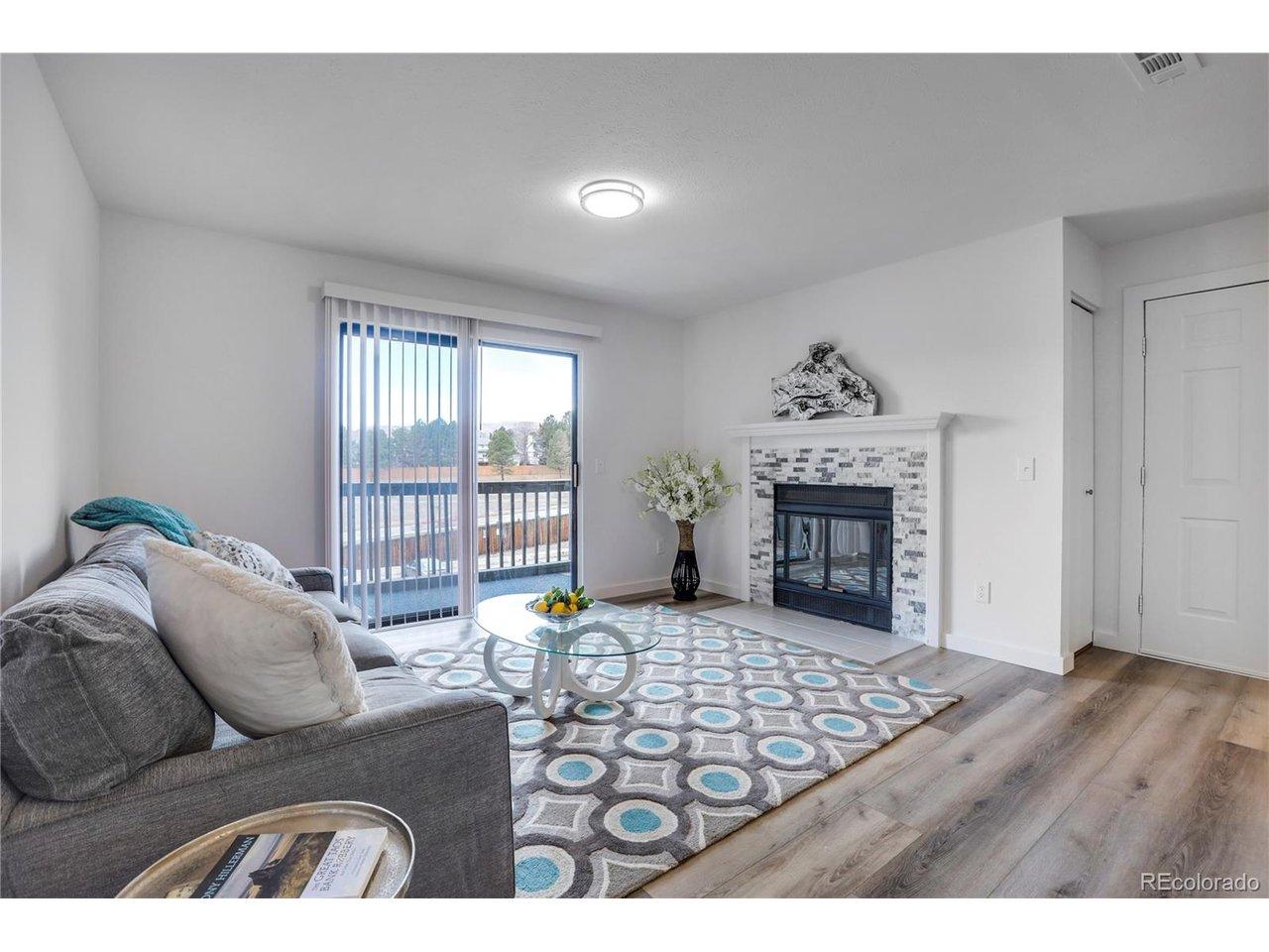 Image 2: Light and bright living area with wood burning fireplace Image 2: Light and bright living area with wood burning fireplace