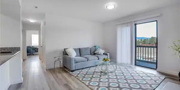 Image 4: Living area looking towards primary bedroom