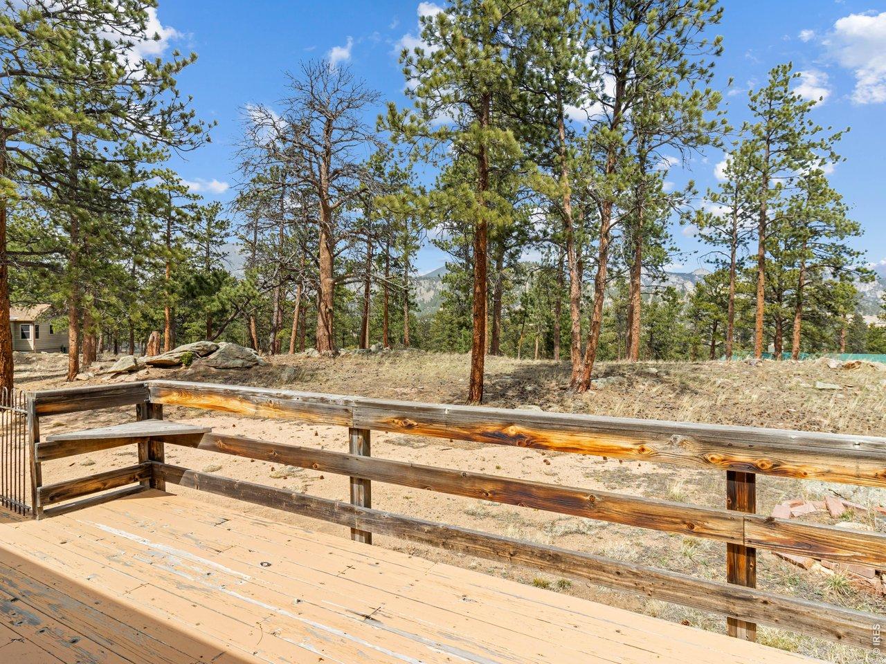 Image 4: Set on 0.84 acres with southern exposure, striking rock outcroppings, and towering pine trees Image 4: Set on 0.84 acres with southern exposure, striking rock outcroppings, and towering pine trees