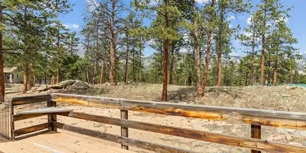 Image 4: Set on 0.84 acres with southern exposure, striking rock outcroppings, and towering pine trees Image 4: Set on 0.84 acres with southern exposure, striking rock outcroppings, and towering pine trees