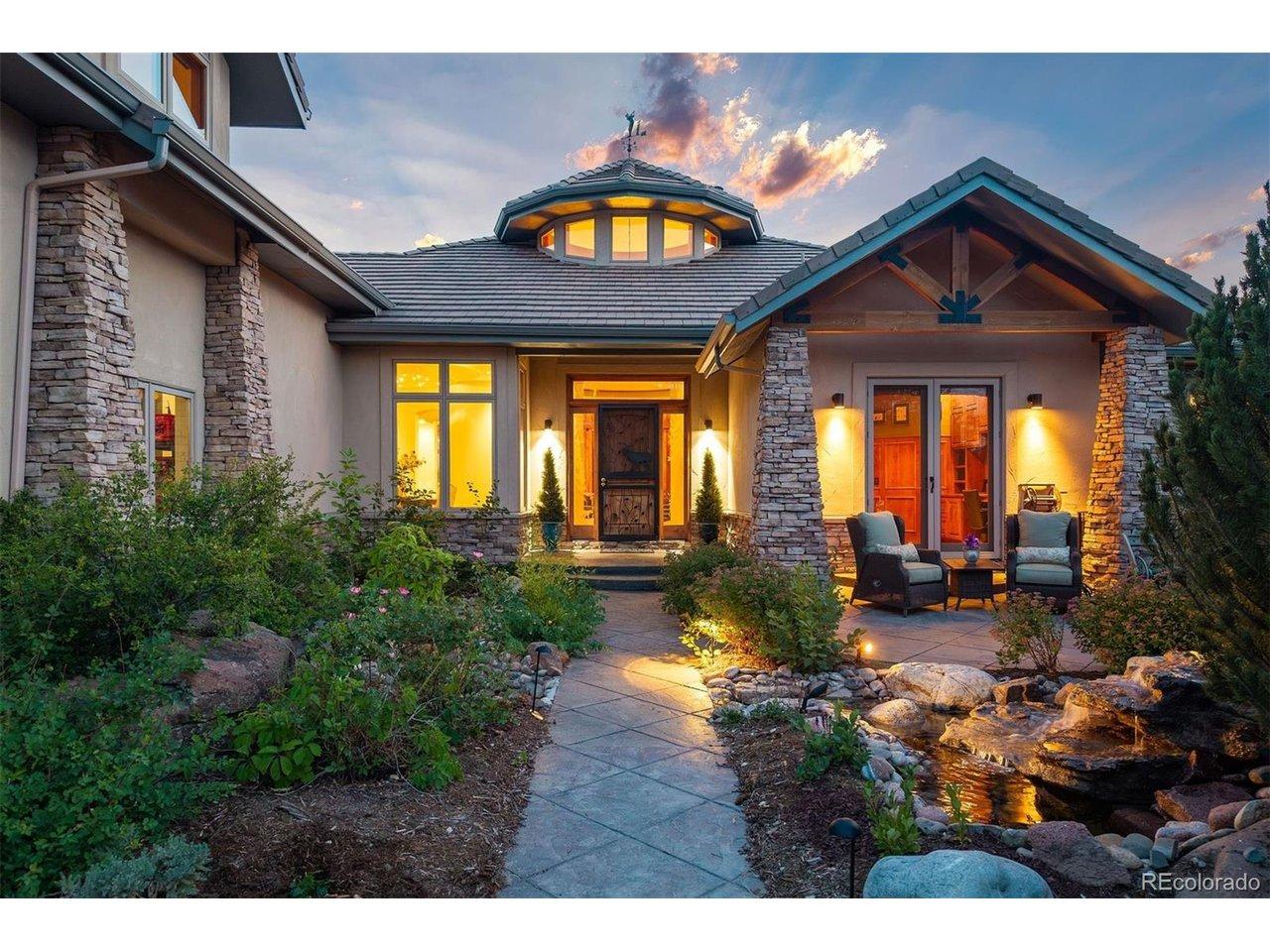 Image 3: A beautifully illuminated front entry welcomes you home, where a tranquil water feature, heated walkway, and thoughtfully landscaped gardens create an unforgettable first impression Image 3: A beautifully illuminated front entry welcomes you home, where a tranquil water feature, heated walkway, and thoughtfully landscaped gardens create an unforgettable first impression