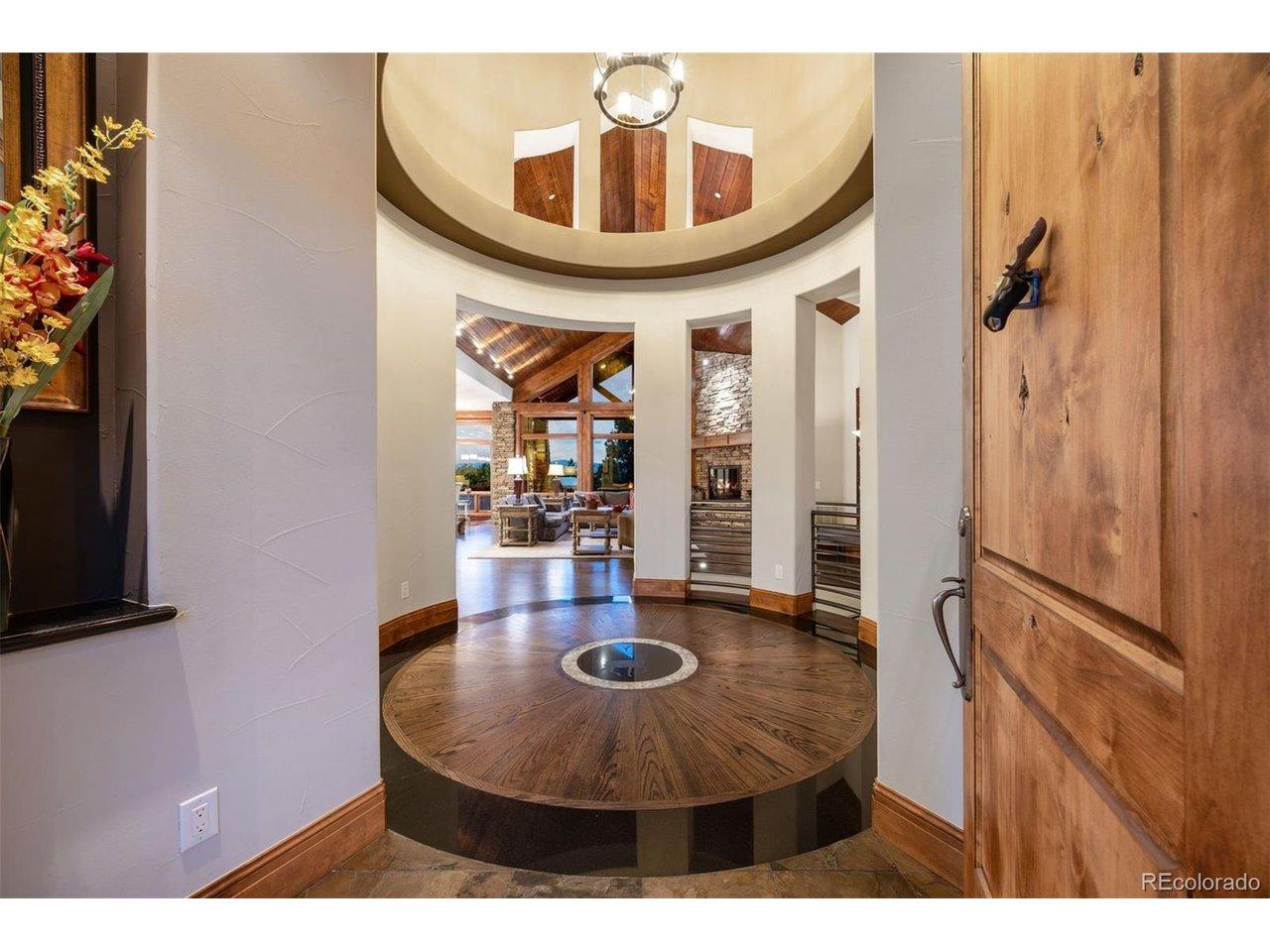 Image 4: Dramatic rotunda entry with custom inlaid wood floor and soaring ceiling Image 4: Dramatic rotunda entry with custom inlaid wood floor and soaring ceiling