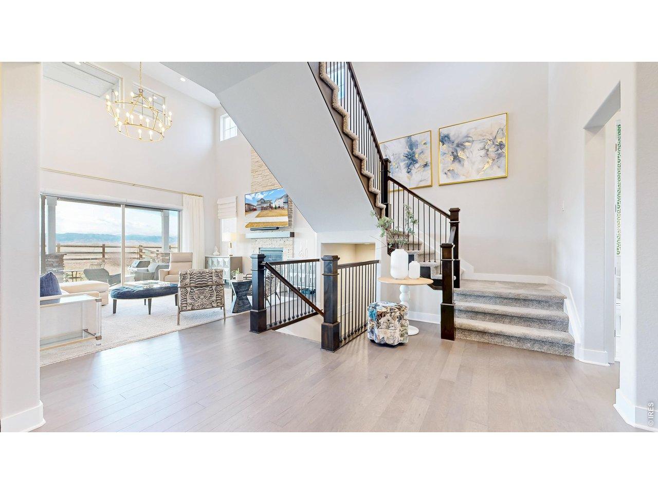 Image 3: Bright entry with high ceilings and warm wood flooring Image 3: Bright entry with high ceilings and warm wood flooring