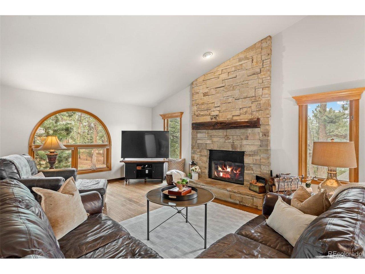 Image 2: Great room with a grand stone fireplace Image 2: Great room with a grand stone fireplace