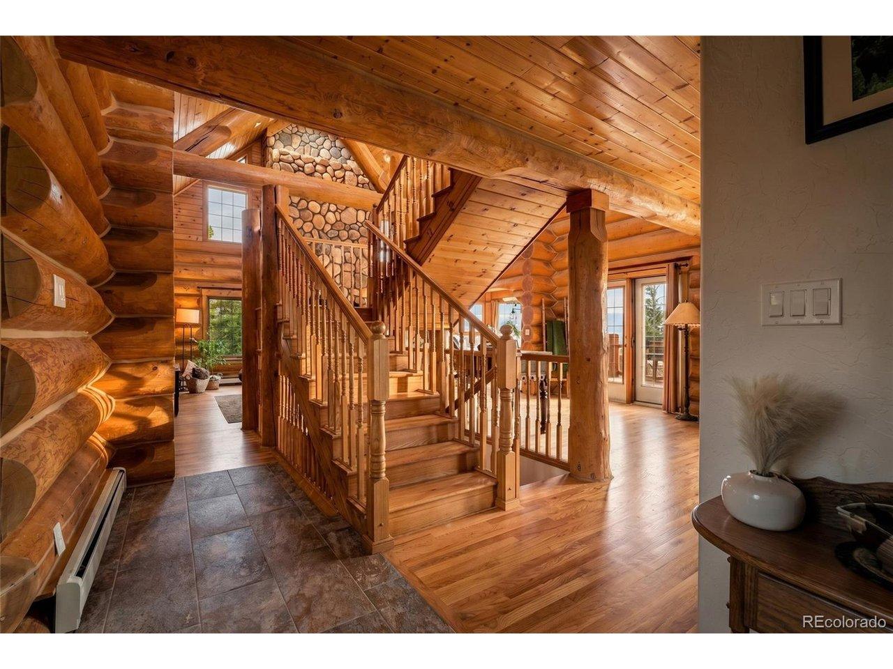 Image 3: Walking through the front door with a half bath to the right