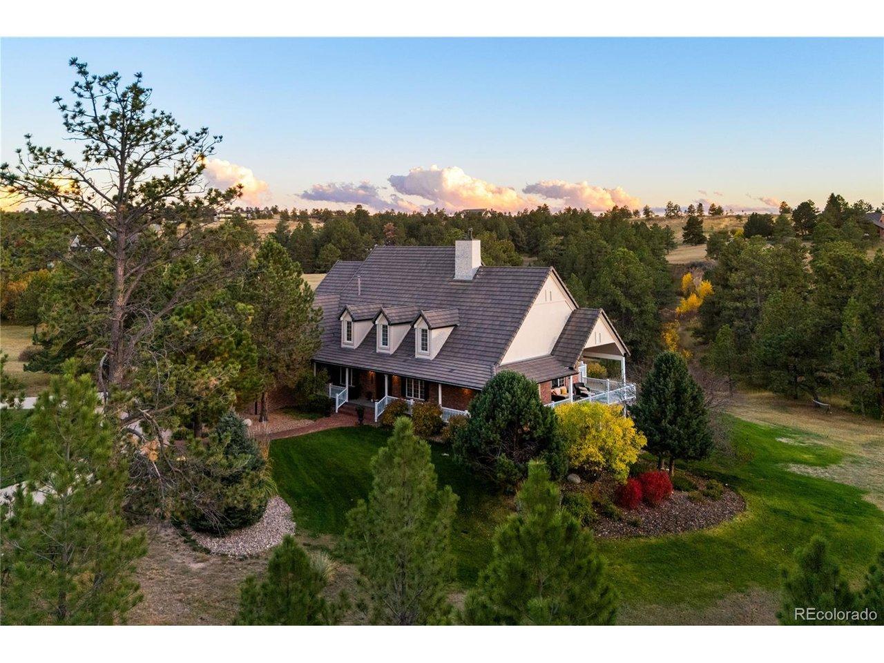 Image 2: Set on five wooded acres with rolling terrain and a peaceful sense of privacy.