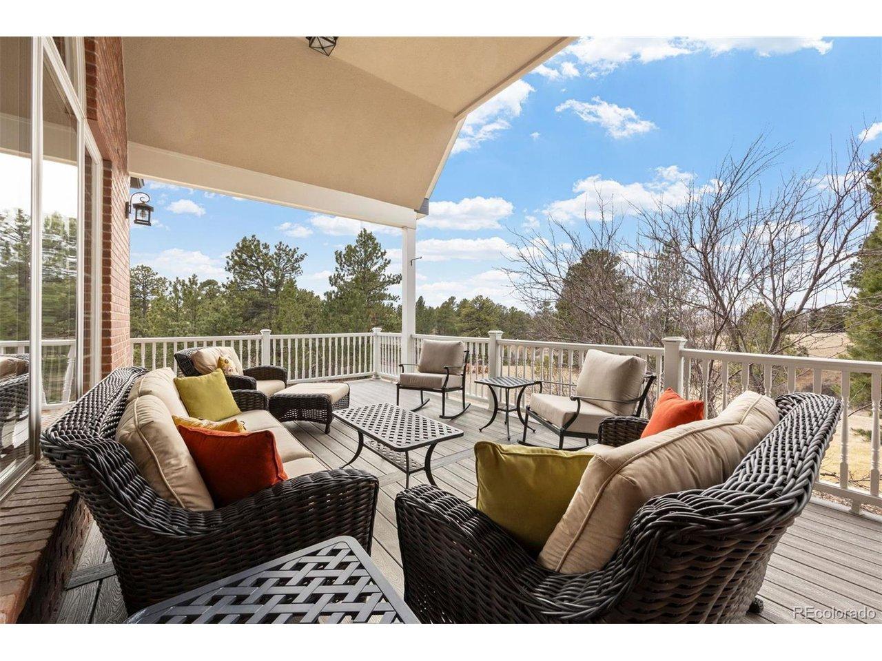 Image 3: Wrap-around porch is one of many outdoor living spaces that define this home.