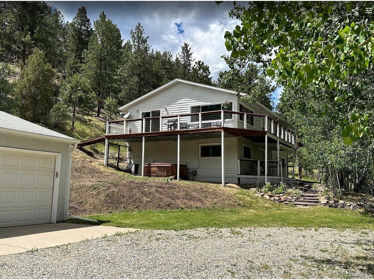 Image 1: South side of house, great southern exposure for driveway and garage.  Pull through driveway