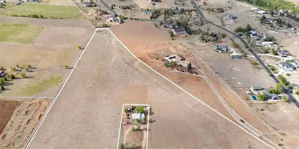 Image 2: 14.25 acres in highly desirable West Loveland with scenic foothill views and a peaceful rural setting.