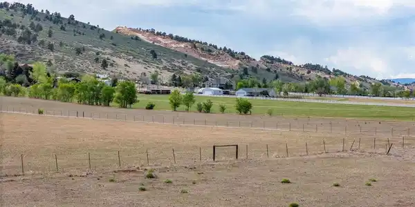 Image 3: Rare vacant land opportunity offering space, privacy, and a beautiful Western Colorado backdrop. Beautiful western sunsets and open skies create an exceptional setting for future possibilities.
