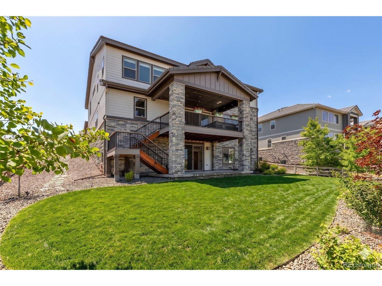 Image 4: Large lot and covered back patio and deck with views of the front range (lawn enhanced) Image 4: Large lot and covered back patio and deck with views of the front range (lawn enhanced)