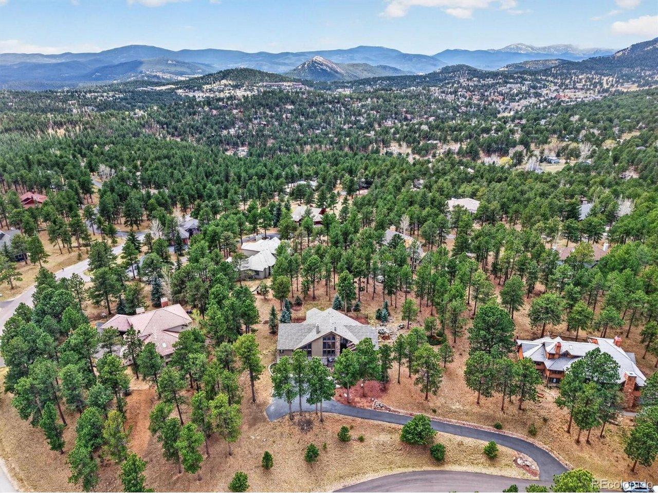 Image 2: Ideally located just minutes from Hiwan Golf Club, the Center for the Arts Evergreen, Elk Meadow Open Space, and an array of shops and dining, the home offers both accessibility and immersion in Colorado's natural beauty, where sightings of elk and native Image 2: Ideally located just minutes from Hiwan Golf Club, the Center for the Arts Evergreen, Elk Meadow Open Space, and an array of shops and dining, the home offers both accessibility and immersion in Colorado's natural beauty, where sightings of elk and native