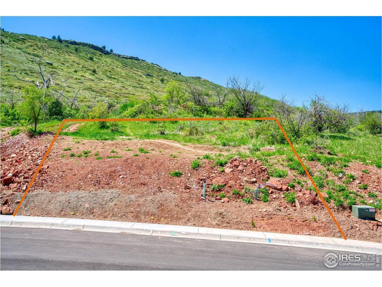 Image 3: Lot view prior to lot prep grading. Notice sewer and water risers. Water and sewer have been already stubbed in and the water dedication fee has been paid.