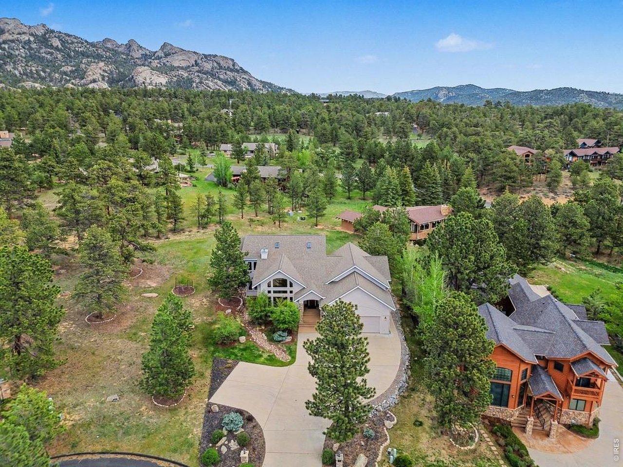 Image 2: A view of the front of the home with the Lumpy Ridge Mountains as a backdrop Image 2: A view of the front of the home with the Lumpy Ridge Mountains as a backdrop