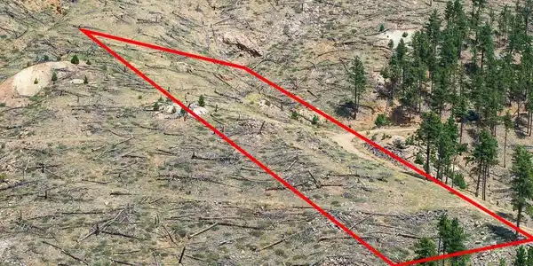 Image 4: There is a short dirt/gravel driveway directly to the building site. Image 4: There is a short dirt/gravel driveway directly to the building site.