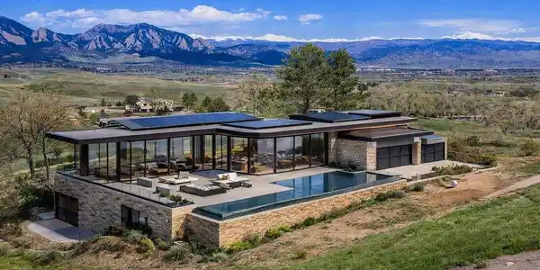 Image 2: Architectural rendering illustrating one possible vision for this exceptional homesite. This contemporary glass pavilion design emphasizes seamless indoor-outdoor living and unobstructed Flatirons views. Images are architectural renderings for illustrative Image 2: Architectural rendering illustrating one possible vision for this exceptional homesite. This contemporary glass pavilion design emphasizes seamless indoor-outdoor living and unobstructed Flatirons views. Images are architectural renderings for illustrative