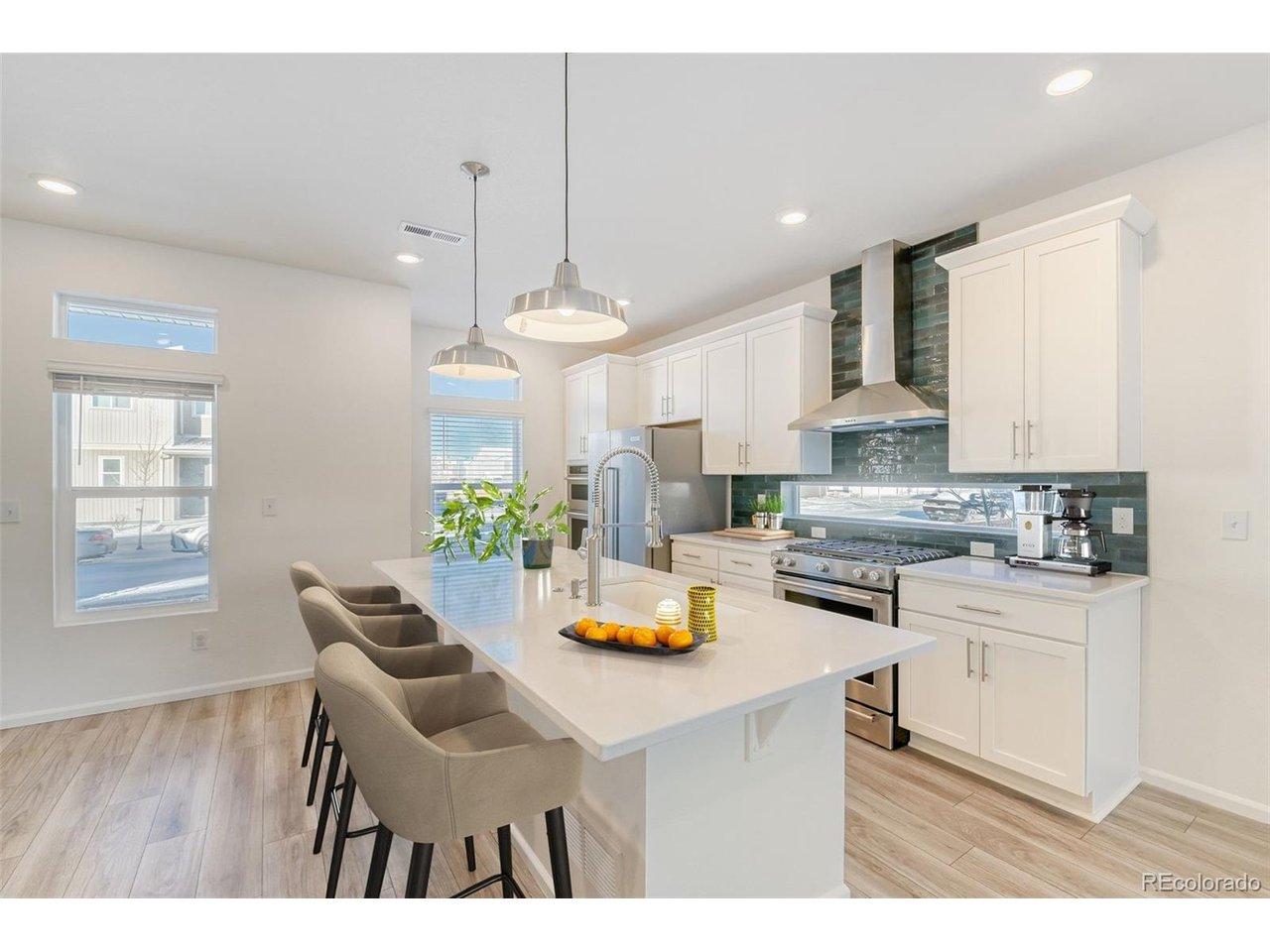 Image 3: Gorgeous Gourmet Kitchen with Professionally Inspired Kitchen Aid 5 Burner Gas Range, Double Ovens, Convection Microwave, Quartz Counters, 42 In Cabinets, Pantry and more