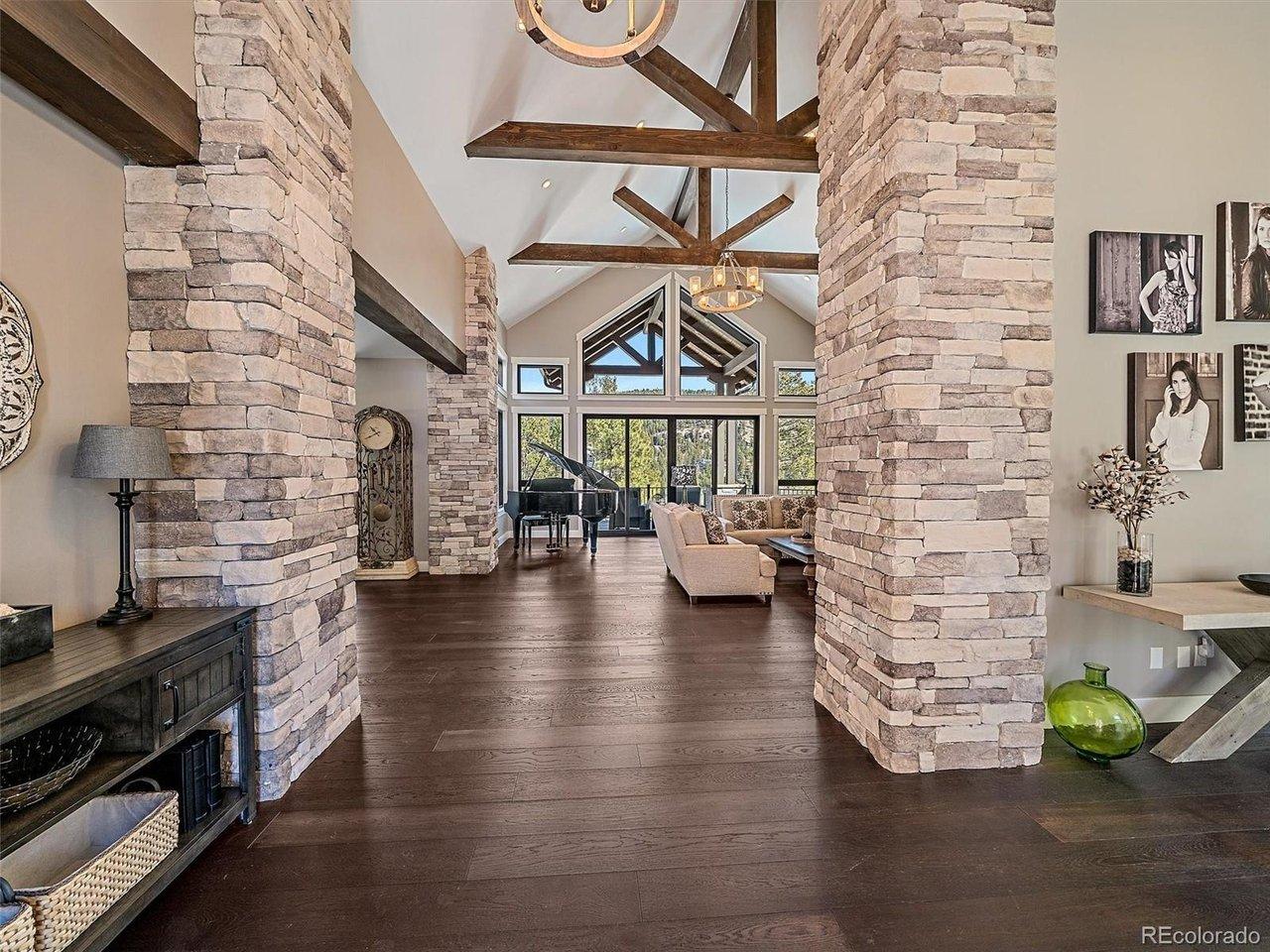 Image 3: Grand foyer looking into the great room.