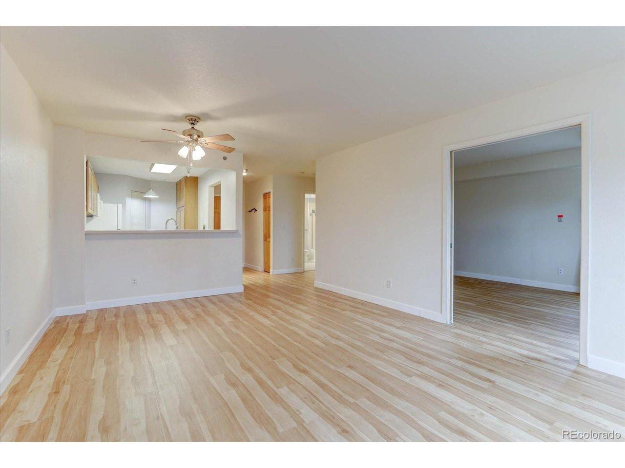Image 4: Dining room with flow to both kitchen and living room.