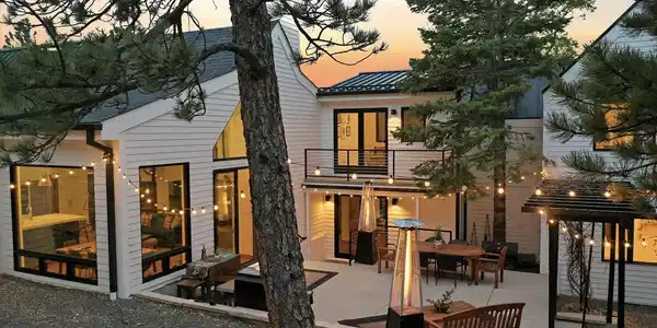 Image 4: Seamless indoor- outdoor living throughout with expansive upper and lower IPE wood decking and private patios with panoramic mountain views.