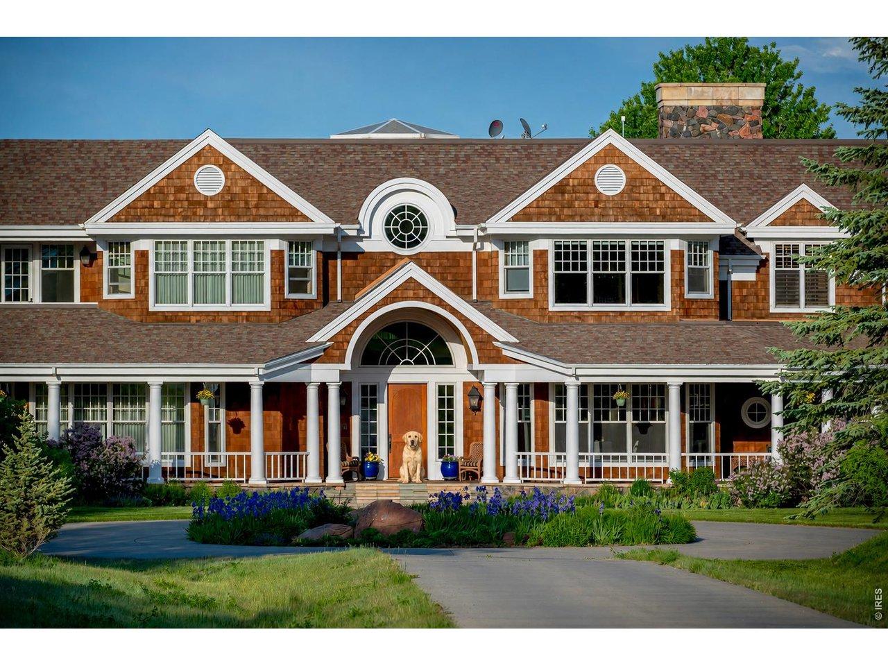 Image 3: You are welcomed to the home by your dog and a circular driveway, wrap-around covered verandas and a grand arch inspired by a sailboat.
