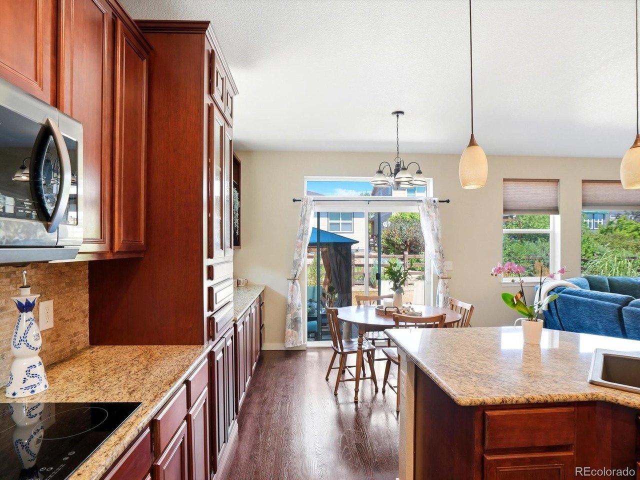 Image 4: Adjacent breakfast nook and access to backyard patio