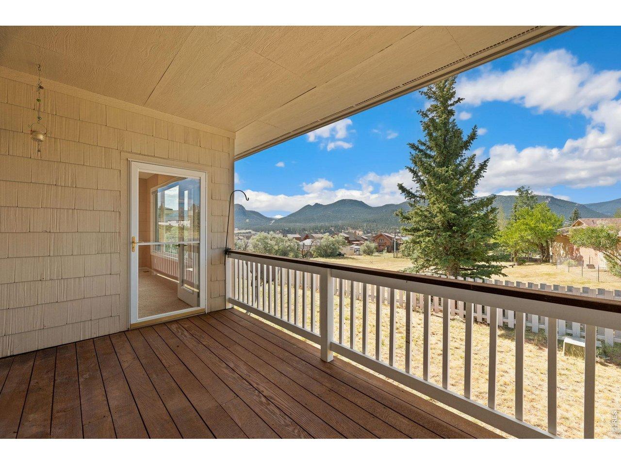 Image 4: Covered deck with views of Twin Sisters, Lake Estes, and Longs Peak Image 4: Covered deck with views of Twin Sisters, Lake Estes, and Longs Peak