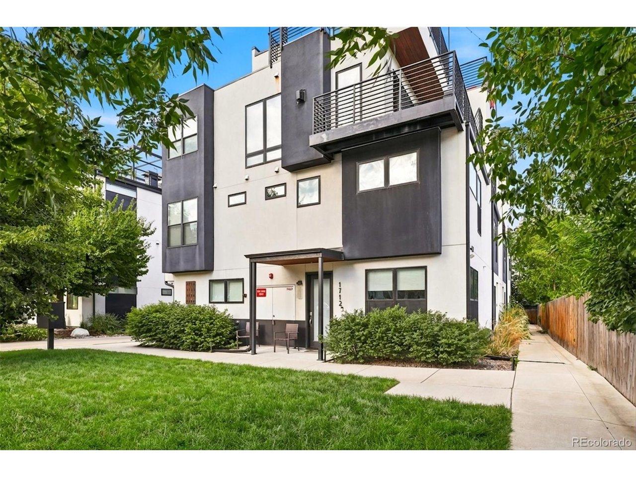 Image 2: A private, landscaped entrance welcomes you to this contemporary Sloan's Lake townhome.