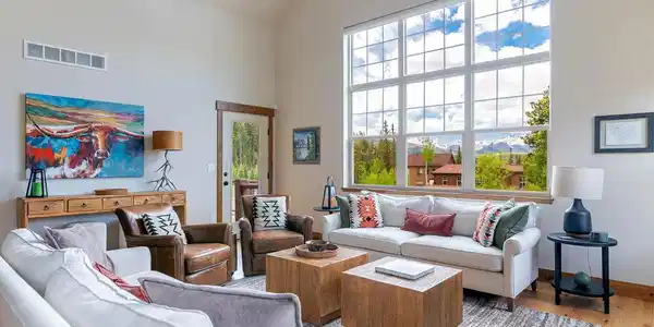 Image 2: Open and inviting living room with abundant natural light