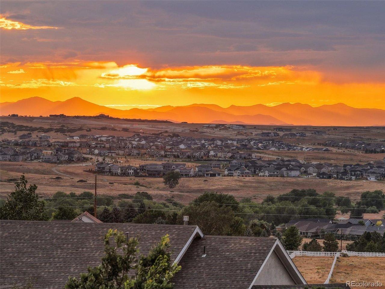 Image 3: Dramatic western skies and expansive mountain views define the elevated setting of this 2.5-acre property.