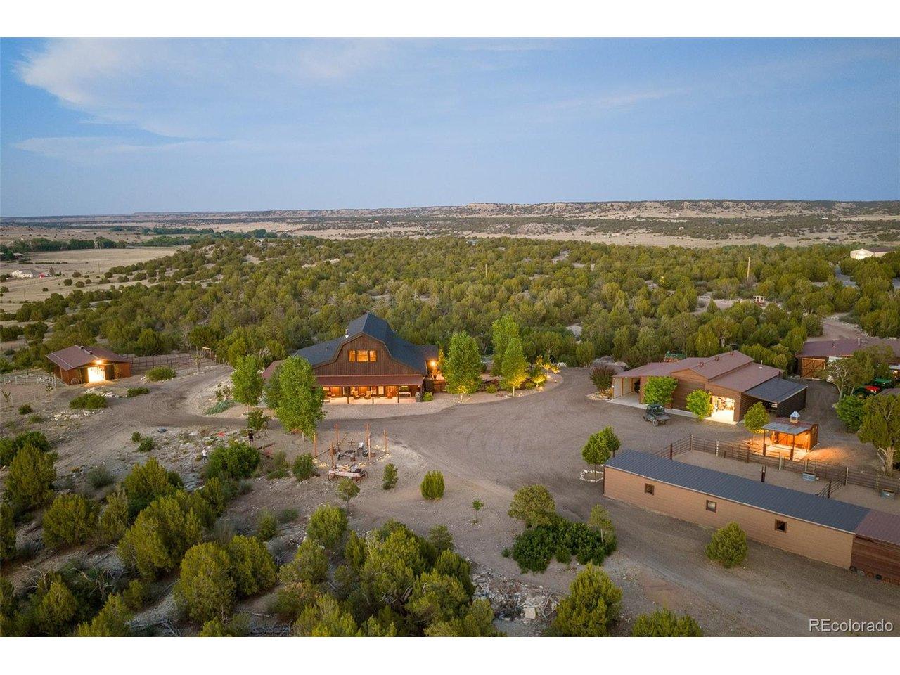 Image 3: An aerial perspective captures the residence, surrounding outbuildings and extensive internal infrastructure woven throughout the property. Image 3: An aerial perspective captures the residence, surrounding outbuildings and extensive internal infrastructure woven throughout the property.