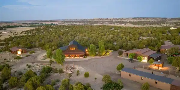 Image 3: An aerial perspective captures the residence, surrounding outbuildings and extensive internal infrastructure woven throughout the property. Image 3: An aerial perspective captures the residence, surrounding outbuildings and extensive internal infrastructure woven throughout the property.